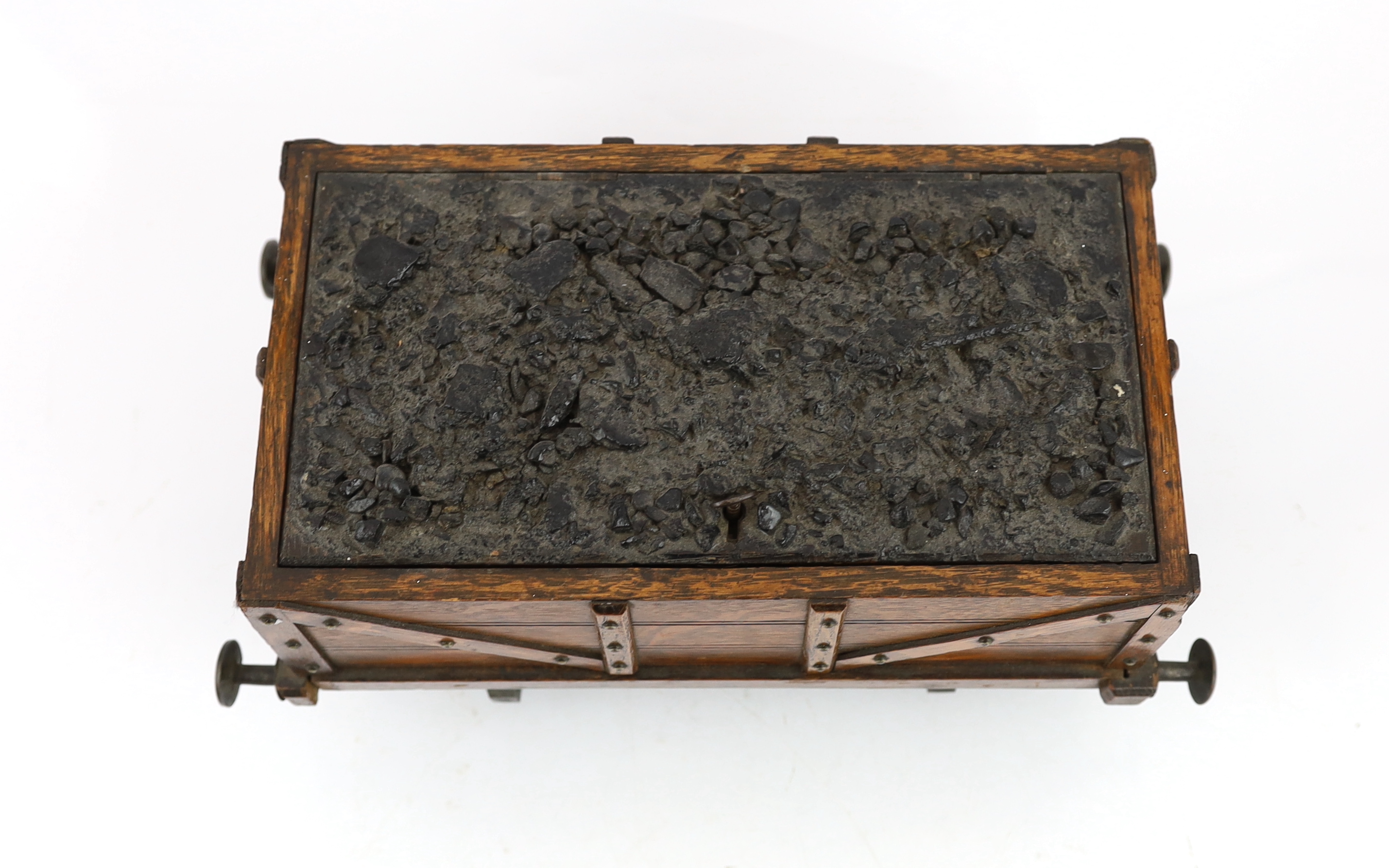 An Edwardian novelty oak smoker's compendium modelled as a railway tender, 34cm wide, 17cm deep, 17cm high